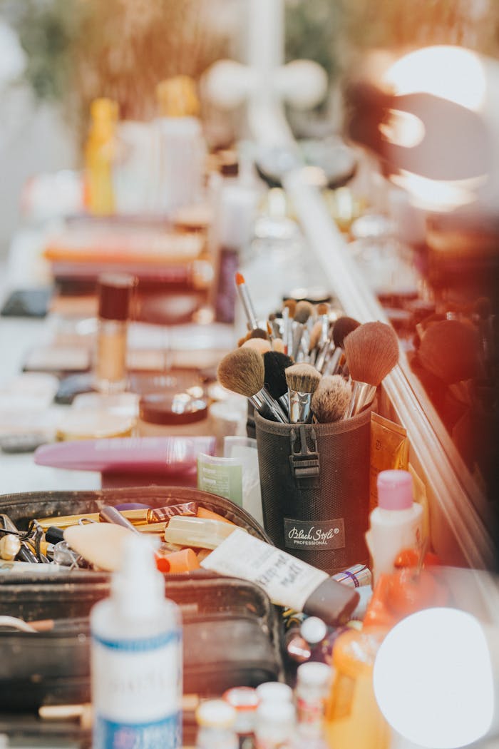about-01 A colorful makeup station filled with brushes and cosmetics in a neatly organized fashion.